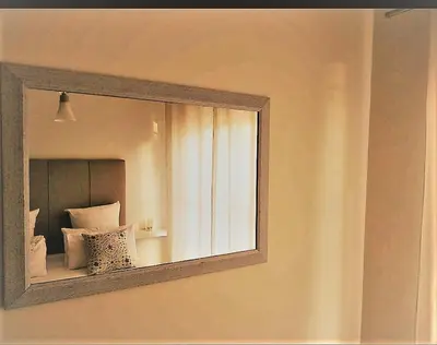 a mirror hanging on a wall in a room at The Blyde Crystal Lagoon in Pretoria