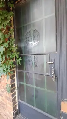 a door with a window with a sign on it at Wooden Creek Estate in Kempton Park
