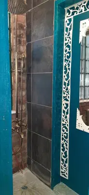 a bathroom with a blue door and a wall at Wooden Creek Estate in Kempton Park