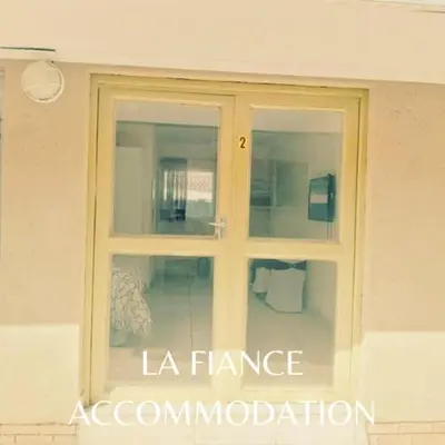 a window with the words la france association on it at La Fiance Village in Polokwane