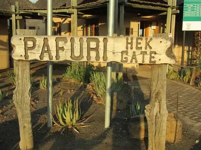 a wooden sign that reads papu lick safe at Pafuri Gate Guesthouse in Mabalingwe Game Reserve