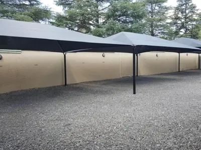 a large black and white tent in a parking lot at Euforia Guesthouse in Middelburg