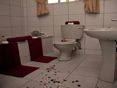 a bathroom with a toilet and a sink at Golden Pillow Guest House in Polokwane
