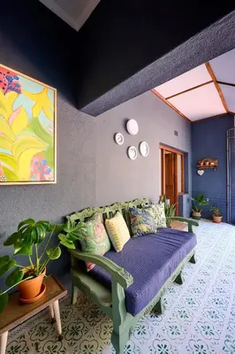 a living room with a couch in a room at The BeeKeeper's Inn in Louis Trichardt