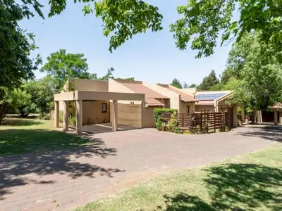 a house with a large driveway in front of it at 1 Bedroom Cottage in Midrand