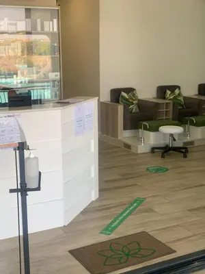 a living room with a couch and a table at The Blyde in Pretoria