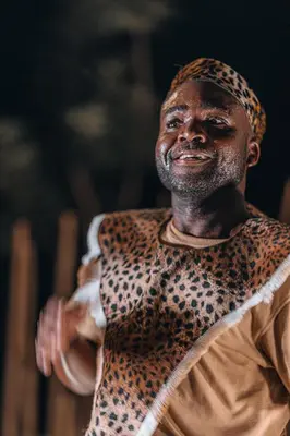 a man wearing a leopard shirt at Oase by 7 Star Lodges - Greater Kruger Private 530ha Reserve in Hoedspruit
