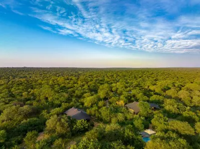 an aerial view of a house in the middle of a forest at Oase by 7 Star Lodges - Greater Kruger Private 530ha Reserve in Hoedspruit