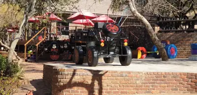 a toy car sitting on top of a brick wall at Milkwood Valley Lodge, Mabalingwe in Bela-Bela