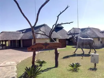a sign in front of a house with a horse at Matori Lodge in Modimolle
