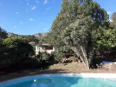 a view of the house from the swimming pool at Goederus Guest Farm in Sterkspruit