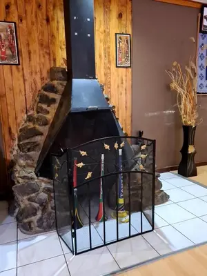 a fireplace with golf equipment inside of it at Baraka House in Midrand