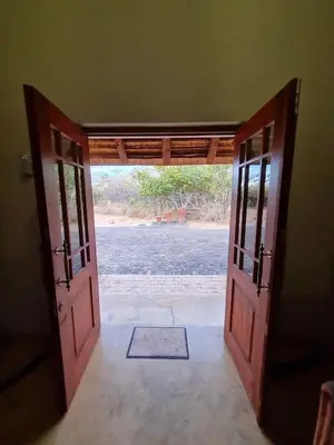 an open door to a room with a view at Pumba's Place Zebula 6 Bedroom House in Mabula