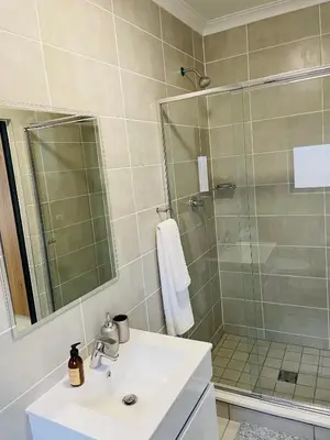 a bathroom with a sink and a shower at The Blyde Unit 1321 in Pretoria