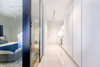 a hallway with a glass door leading to a bedroom at Alimama Spaces: The Fountain Hill Ellipse in Midrand