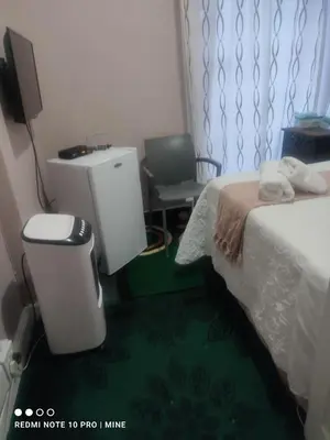 a hotel room with a bed and a sink at The Croc Guest house in Springs