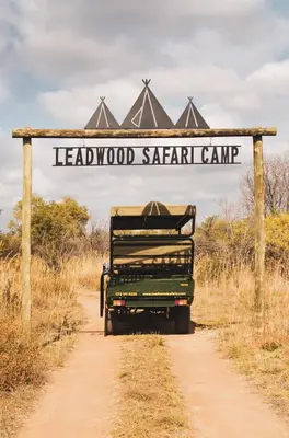 a sign that reads leadwood safari camp on a dirt road at The Leadwood Safari Camp in Dinokeng Game Reserve
