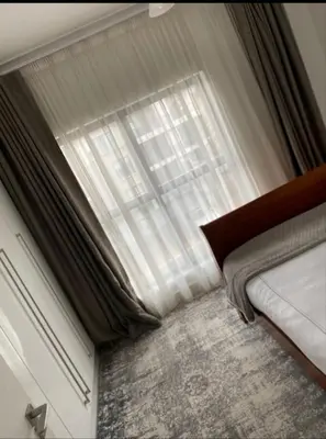 a bedroom with a bed and a large window at Le Bon Dieu in Midrand