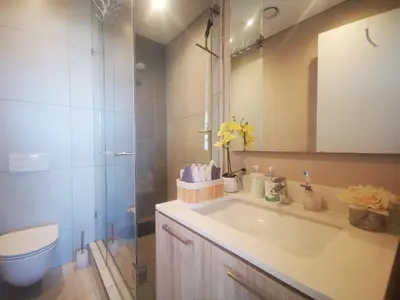 a bathroom with a sink and a shower and a toilet at Comfort at 1503 Menlyn Maine Residences in Pretoria
