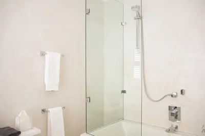 a bathroom with a shower with a glass door at Augusta Palms in Centurion