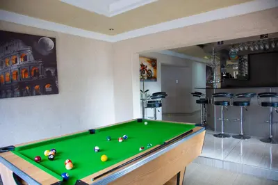 a room with a pool table and a bar at ANGELOCEAN GUEST HOUSE in Witbank