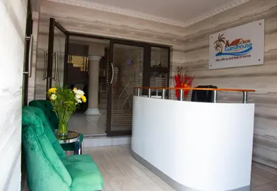 a lobby with a counter and chairs in a room at ANGELOCEAN GUEST HOUSE in Witbank