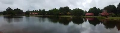 a large body of water with houses and trees at Critchley Hackle - Tower rooms in Dullstroom