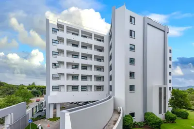 an external view of a white building at The Regency Apartments in Pretoria