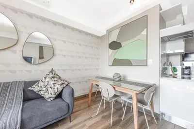 a living room with a couch and a table at The Regency Apartments in Pretoria