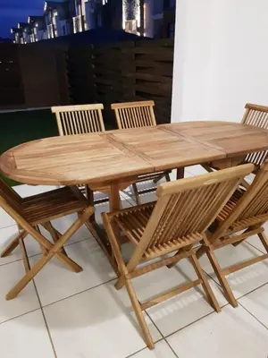 a wooden table with four chairs around it at Apartment 432 @ The Blyde Riverwalk Pretoria in Pretoria