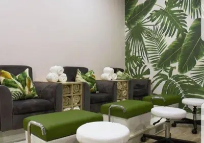 a living room with green furniture and green stools at Apartment 432 @ The Blyde Riverwalk Pretoria in Pretoria