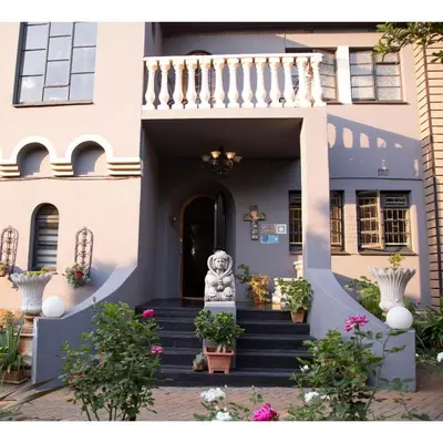 a building with a statue in front of it at Ben's Bed and Breakfast in Pretoria