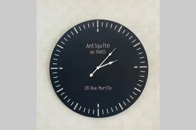 a black clock on a wall with the words attitude of planes at Phoenix Rising Apartment in Midrand