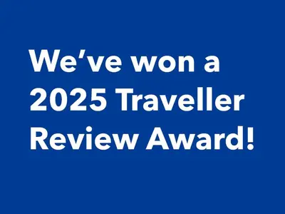 a blue background with the words were won a traveller review award at Lesedi Self Catering in Pretoria
