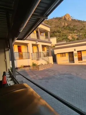 a view of a house from a bus at SummerField Guest House in eNyamazaneni