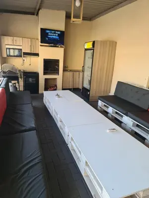 a large room with two beds in it at SummerField Guest House in eNyamazaneni