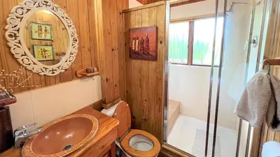 a bathroom with a sink and a toilet and a shower at Kruger Kumba - Mugwenzi in Marloth Park