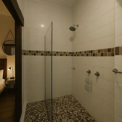 a shower with a glass door in a bathroom at Ratel Street Guesthouse in Pretoria