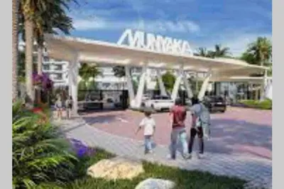 a group of people walking in front of a building at Spectacular 2 bedroom Penthouse Apartment in Midrand
