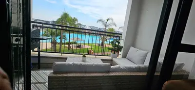 a balcony with a couch and a view of the ocean at The Blyde Beach View in Pretoria