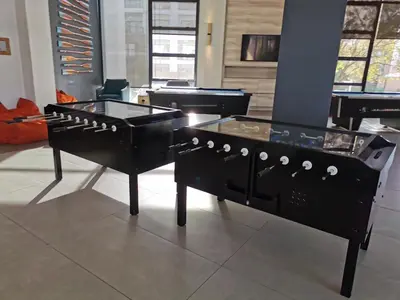 two black pianos on display in a room at The Blyde Beach View in Pretoria