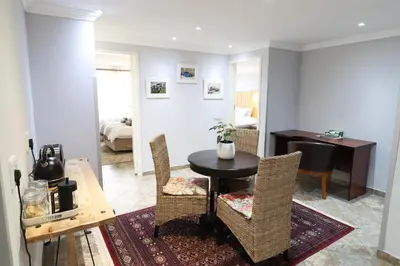 a dining room with a table and chairs at 7 At Brainline in Pretoria