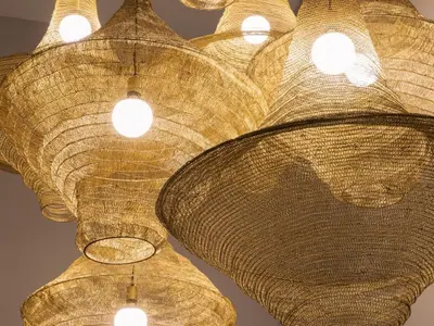 a bunch of wicker lights hanging from a ceiling at Askara Haus in Pretoria