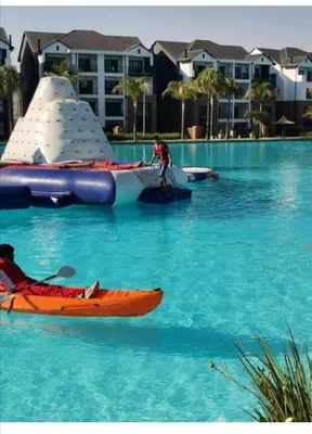 a man on a raft in the water with a kayak at The Blyde in Pretoria