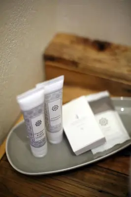 a tray with two bottles of lotion on a table at SOUSIE'S RUSTIC STAY in Polokwane