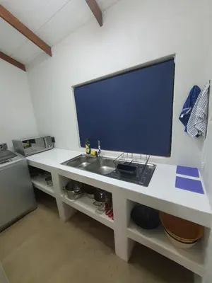 a white desk with a sink and a television on it at Lionsview Private Lodge - 4 Lions in Marloth Park