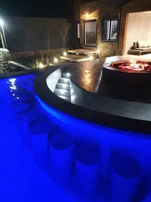 a swimming pool with blue lights in a room at Via Lactea in Mmafefe