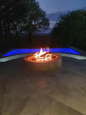 a fire pit in a parking lot at night at Via Lactea in Mmafefe
