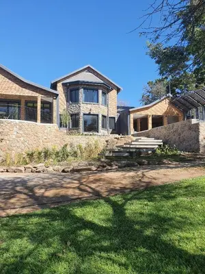 a house with a picnic table in front of it at Via Lactea in Mmafefe