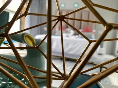 a view through a metal grid of a room at The King's Court Guest Manor in Bela-Bela